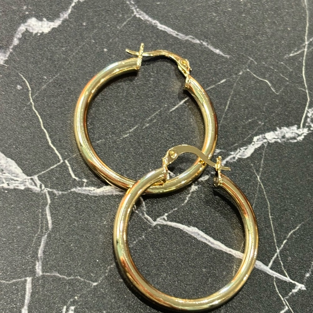 Gold plated hoops.